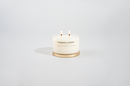 Bougie à la cire de soja avec couvercle doré champagne et fraises